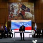 Chevron's president for Venezuela, Javier La Rosa, signs the deal aimed with PDVSA at reviving crude output and expanding operations in the country, in Caracas, Venezuela, December 2, 2022. Photo: Reuters/Leonardo Fernández Viloria.