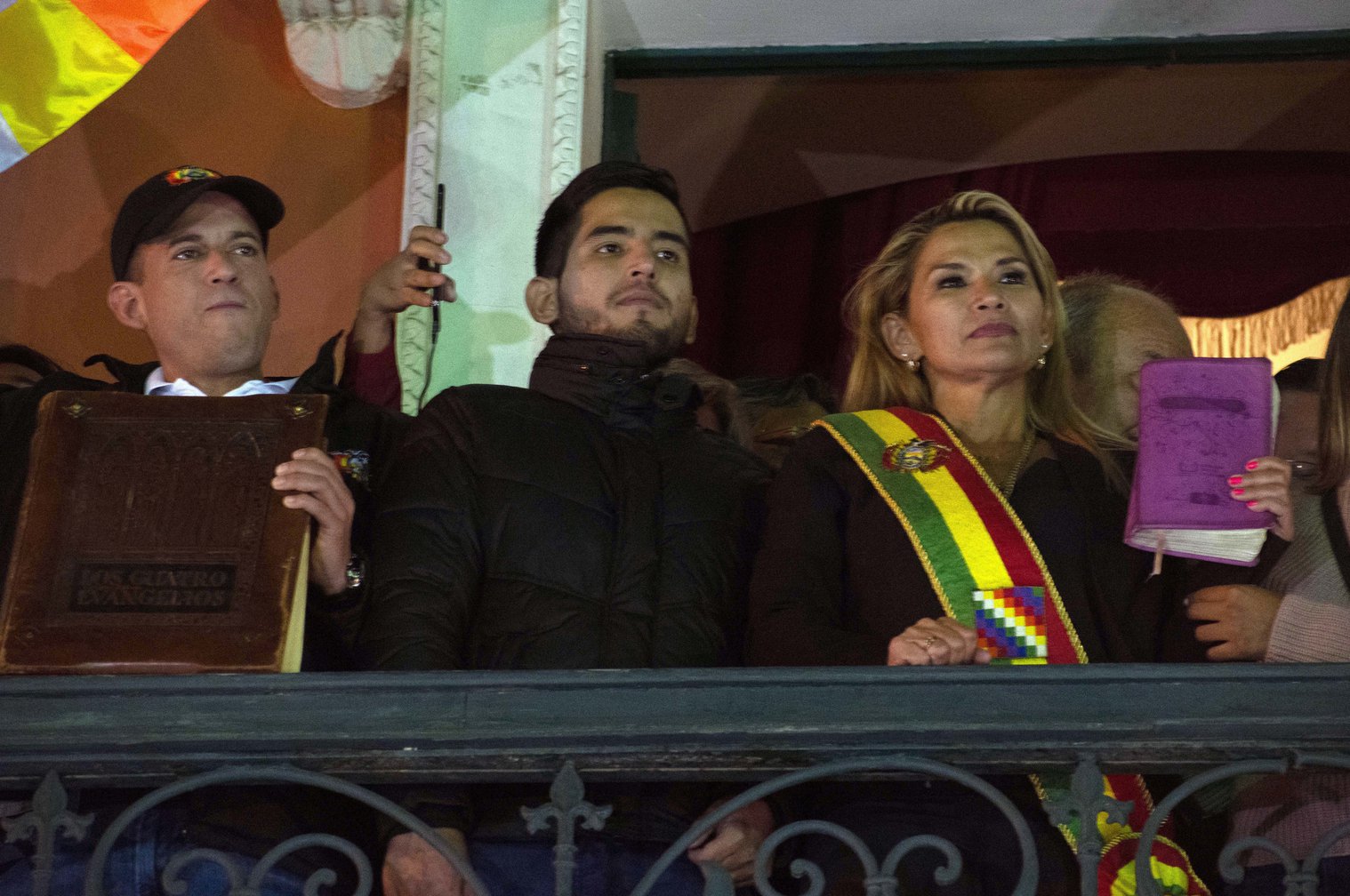 Jeanine Añez, after proclaiming herself de facto president of Bolivia, with a bible in her hand. Luis Fernando Camacho is next to her (left) holding a bigger bible. Photo: PA Images.