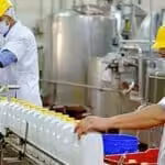 Venezuelan workers at a dairy processing facility. File photo.