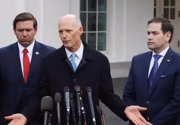 Senator Rick Scott giving statements to the press outside the White House, escorted by Senator Marco Rubio and Florida Governor Ron DeSantis. Photo: Phil Ammann.