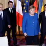 Vladimir Putin, Emmanuel Macron, Angela Merkel and Volodymyr Zelensky (left to right) at a meeting in Paris. Photo: Reuters. 
