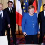 Vladimir Putin, Emmanuel Macron, Angela Merkel and Volodymyr Zelensky (left to right) at a meeting in Paris. Photo: Reuters. 