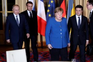 Vladimir Putin, Emmanuel Macron, Angela Merkel and Volodymyr Zelensky (left to right) at a meeting in Paris. Photo: Reuters. 