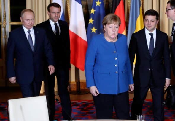Vladimir Putin, Emmanuel Macron, Angela Merkel and Volodymyr Zelensky (left to right) at a meeting in Paris. Photo: Reuters. 
