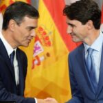 Vassal meeting fellow vassal: Pedro Sanchez, Spain's PM, shakes hands with Canada's Justin Trudeau. Their nations are no longer sovereign, but submission to the US-enforced "Rules-Based Order" does not seem to bother them. File photo.