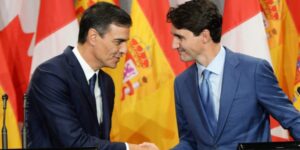 Vassal meeting fellow vassal: Pedro Sanchez, Spain's PM, shakes hands with Canada's Justin Trudeau. Their nations are no longer sovereign, but submission to the US-enforced "Rules-Based Order" does not seem to bother them. File photo.