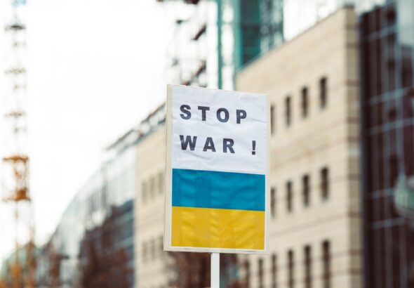 Image of a banner with a "Stop War" caption and the Ukrainian flag below. File photo.