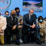 Hakeem Jeffries, left, kneeling with the Rev. Al Sharpton and Mayor Bill DeBlasio to commemorate the anniversary of George Floyd’s death. Photo: Gabriela Bhaskar for The New York Times.