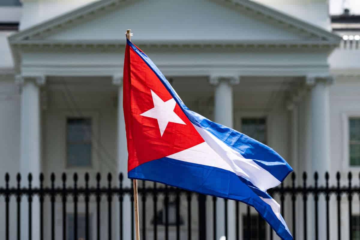 A demonstrator holds up the Cuban flag while protesting in front of the White House in Washington, D.C., on July 12, 2021. Photo: Jim Watson/AFP via Getty images.