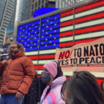 A man delivers a speech during a rally at Times Square in New York, the United States, Jan. 14, 2023. Photo: Ziyu Julian Zhu/Xinhua.