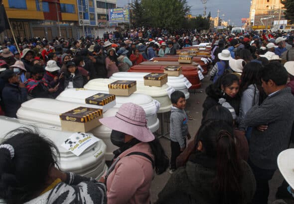Relatives of 18 people killed by police repression wait with empty coffins outside the morgue of the Carlos Monge Medrano hospital in Juliaca, southern Peru, on January 10, 2023. Photo: Juan Carlos Cisneros/AFP.