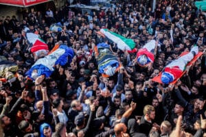 Crowds of mourners gather at funeral for nine Palestinians killed by Israeli military on Thursday, January 26. Photo: Nasser Ishtayeh/Flash90.