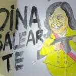 Protest banner showing a caricature of Boluarte holding a machine gun next to a caption that reads "Dina Balearte." Photo: Twitter/@renato_2026.