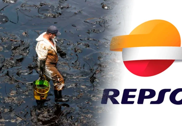 Worker wearing protective suit in an area flooded with oil. Photo: Andina-Repsol.