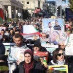 Palestinians marching. Photo: WAFA Images/Mustafa Abu Dayyah.