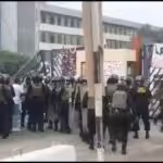 Police outside the gates of San Marcos University in Lima, Peru, on the morning of January 21, preparing to evict protesters from the university premises. Photo from social media.