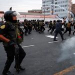 Police launch tear gas at protesters in Lima, Peru. Photo: AFP.