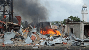 Fire and smoke rise from a house destroyed by US airstrike in Somalia. File photo.