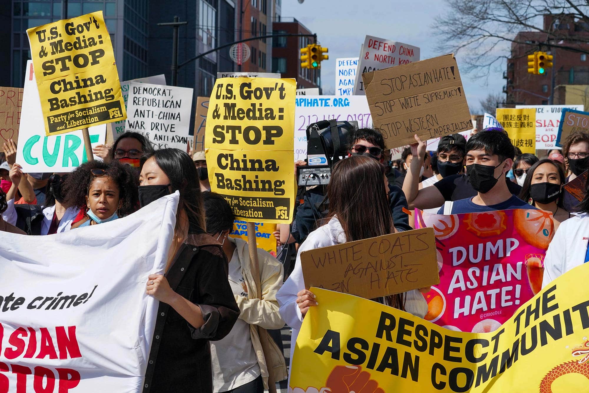 Demonstrators hold signs during an AANHPI Rally Against Hate in Flushing, Queens, New York. Photo: John Nacion/Star Max/IPX.