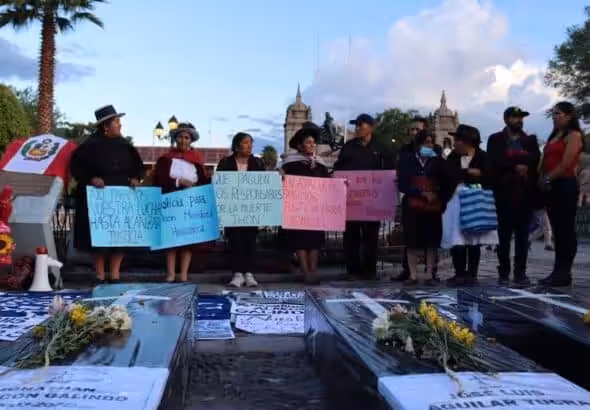 Women from the Ayacucho-based National Association of Relatives of Kidnapped, Detained and Disappeared of Peru (ANFASEP) hold signs in the central plaza of Ayacucho condemning the deaths of protesters. Photo: Zoe Alexandra.
