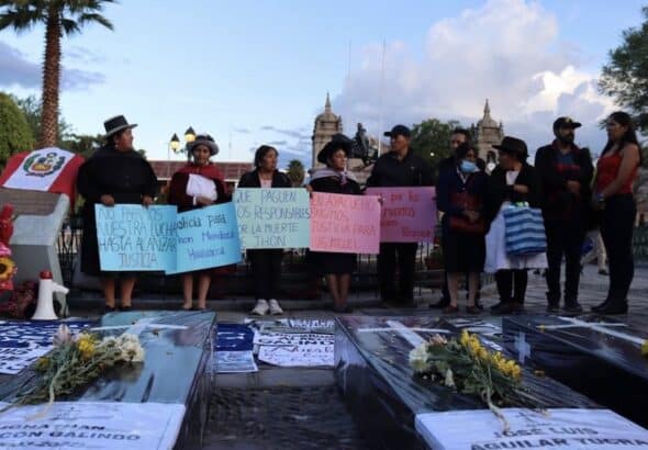 Women from the Ayacucho-based National Association of Relatives of Kidnapped, Detained and Disappeared of Peru (ANFASEP) hold signs in the central plaza of Ayacucho condemning the deaths of protesters. Photo: Zoe Alexandra.