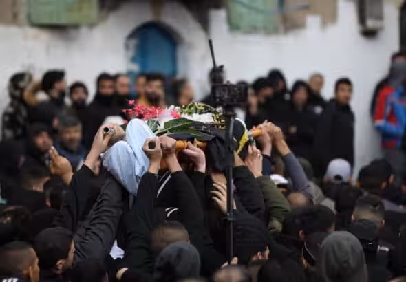 Mourners carry the bodies of two Palestinian resistance fighters who were killed in Jenin, January 14, 2023. Photo: APA Images.