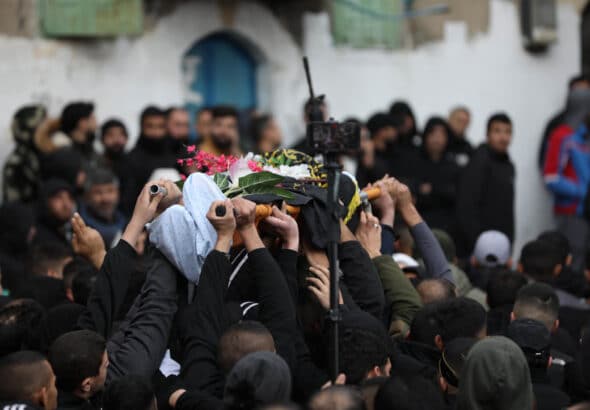 Mourners carry the bodies of two Palestinian resistance fighters who were killed in Jenin, January 14, 2023. Photo: APA Images.