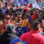 Venezuelan President Nicolás Maduro next to his wife and national assembly deputy, Cilia Flores, while marching among ordinary Venezuelans in a January 23 demonstration. Photo: Presidential Press.