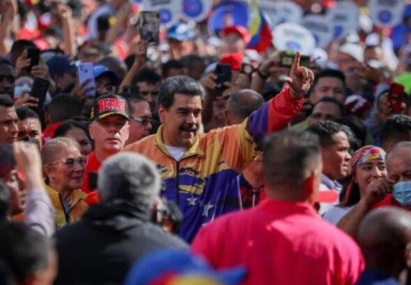 Venezuelan President Nicolás Maduro next to his wife and national assembly deputy, Cilia Flores, while marching among ordinary Venezuelans in a January 23 demonstration. Photo: Presidential Press.