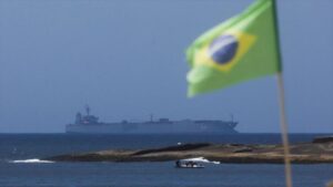 The Iranian ship Iris Makran sails off the coast of Rio de Janeiro as a Brazilian flag flies on Copacabana beach, February 27, 2023. Photo: Reuters.
