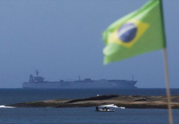 The Iranian ship Iris Makran sails off the coast of Rio de Janeiro as a Brazilian flag flies on Copacabana beach, February 27, 2023. Photo: Reuters.