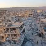 An aerial view shows the destroyed buildings in the rebel-held town of Jindayris on February 9, 2023, three days after a deadly earthquake that hit Turkey and Syria. Photo: Omar HAJ KADOUR /AFP.