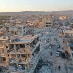 An aerial view shows the destroyed buildings in the rebel-held town of Jindayris on February 9, 2023, three days after a deadly earthquake that hit Turkey and Syria. Photo: Omar HAJ KADOUR /AFP.