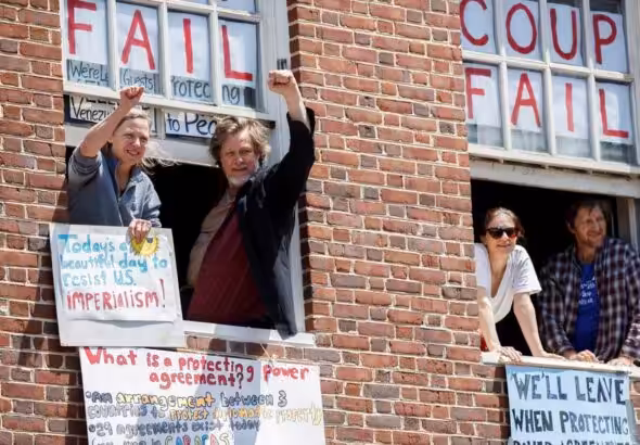 The remaining four members of the Embassy Protection Collective who held down the embassy until they were evicted and arrested by the US Secret Service. Photo: Peoples Dispatch.