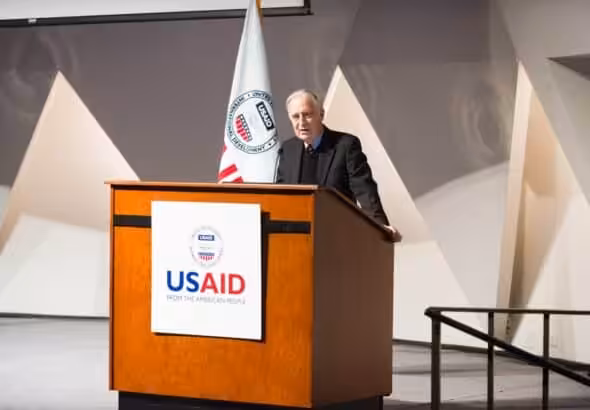 Speaker for the USAID at a conference. Photo: Liberation News.