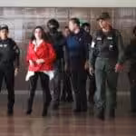 Aída Merlano being escorted by Venezuelan security personnel to one of her court appearances in Venezuela. File photo.