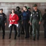 Aída Merlano being escorted by Venezuelan security personnel to one of her court appearances in Venezuela. File photo.