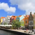 Colorful houses lining a waterfront street in Willemstad, the capital of Curaçao. Photo: Andrés Molina Mesa.