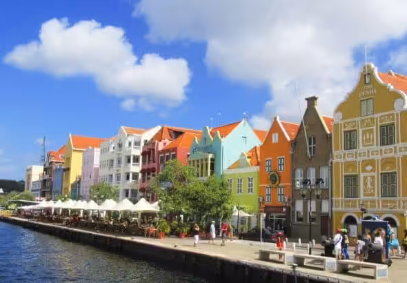 Colorful houses lining a waterfront street in Willemstad, the capital of Curaçao. Photo: Andrés Molina Mesa.