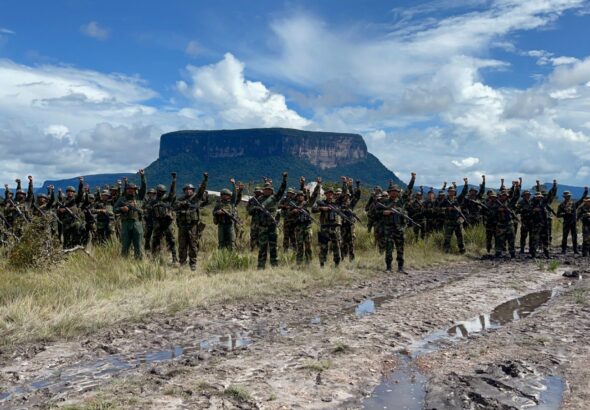 Members of the Bolivarian National Armed Forces salute in front of a protected national park in Venezuela. File photo.