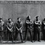 A line of Black Panther Party members as they stand outside the New York City courthouse under a portion of an Abraham Lincoln quote which reads 'The Ultimate Justice of the People.' April 11, 1969. Photo: David Fenton/Getty.