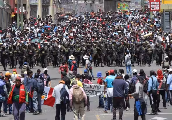 Police forces containing a protest in Peru after the parliamentary coup d'etat against Pedro Castillo. Photo: SADAA Times.