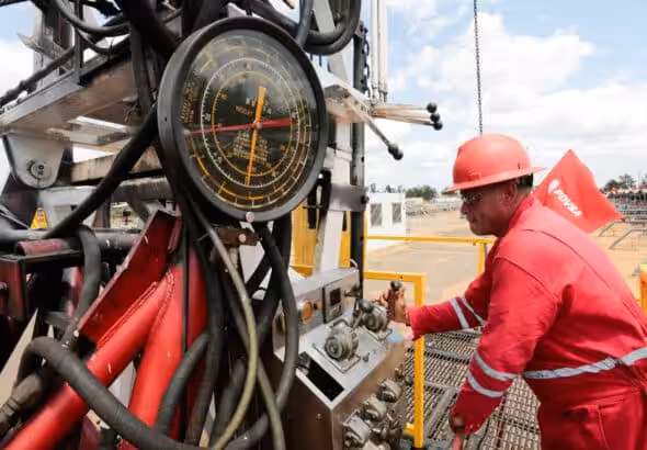 PDVSA Petromonagas worker operating a drilling rig. File Photo.