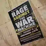 Photo of a poster for the “Rage Against the War Machine” event, organized in Washington DC on February 19, 2023. Photo: WorldBeyondWar.org.