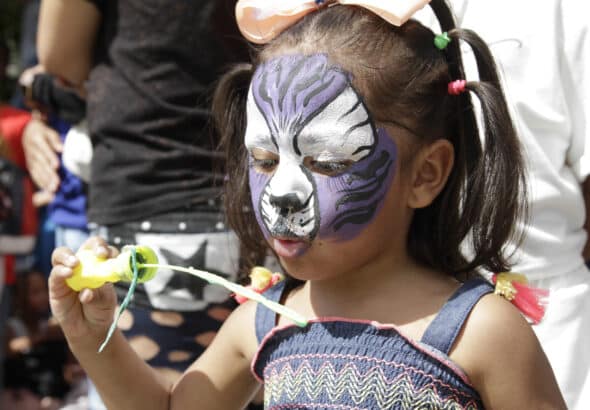 Featured image: Venezuelan girl enjoys the Carnival in Caracas. Photo: Juan Carlos La Cruz.