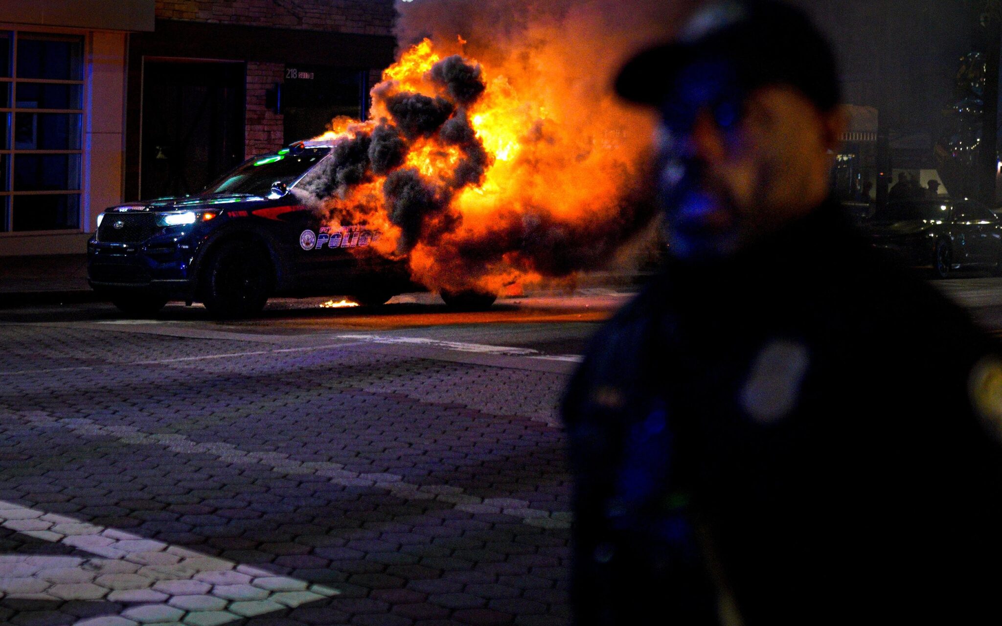 An Atlanta police vehicle set on fire during a Stop Cop City protest in Atlanta, Ga. Photo: Benjamin Hendren/Anadolu Agency via Getty Images.