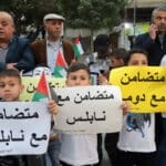 Palestinians take part in a rally in Jabaliya refugee camp in solidarity with West Bank Palestinians and political prisoners in Israeli jails, march 5, 2023. Children carry posters that read “in solidarity with Nablus”. Photo: Youssef Abu Watfa/APA Images.