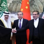Wang Yi, center, China’s top foreign policy official, with Ali Shamkhani, right, the secretary of Iran’s security council, and Musaad bin Mohammed Al Aiban, Saudi Arabia’s minister of state, in Beijing during the ceremony marking the resumption of diplomatic relations between Iran and Saudi Arabia, March 10, 2023. Photo: China Daily.