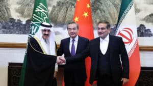 Wang Yi, center, China’s top foreign policy official, with Ali Shamkhani, right, the secretary of Iran’s security council, and Musaad bin Mohammed Al Aiban, Saudi Arabia’s minister of state, in Beijing during the ceremony marking the resumption of diplomatic relations between Iran and Saudi Arabia, March 10, 2023. Photo: China Daily.