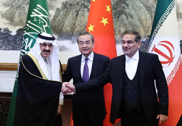 Wang Yi, center, China’s top foreign policy official, with Ali Shamkhani, right, the secretary of Iran’s security council, and Musaad bin Mohammed Al Aiban, Saudi Arabia’s minister of state, in Beijing during the ceremony marking the resumption of diplomatic relations between Iran and Saudi Arabia, March 10, 2023. Photo: China Daily.